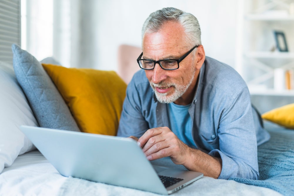mature man working on a laptop computer